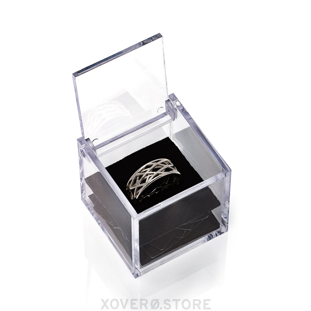 Futuristic solid sterling silver sculptural lattice ring presented in a clear box with custom laser cut neoprene insert.