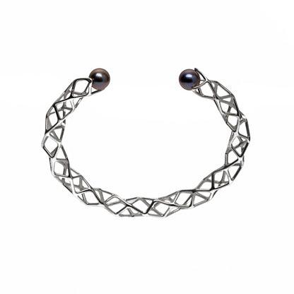 Our solid sterling silver spiraling lattice bracelet is capped with two freshwater black pearls. 