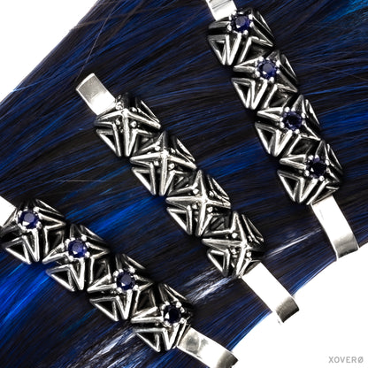Sterling silver spike topped bobby pin worn on blue hair with matching latticework bobby pins set with sapphire. 
