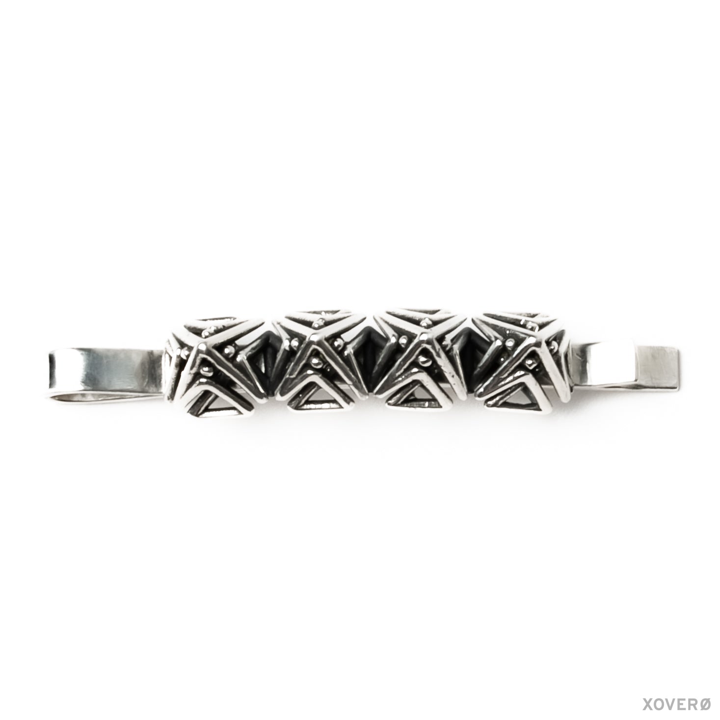 Top view of the precise geometric detail in a sterling silver Art Deco-inspired heirloom hair pin. 