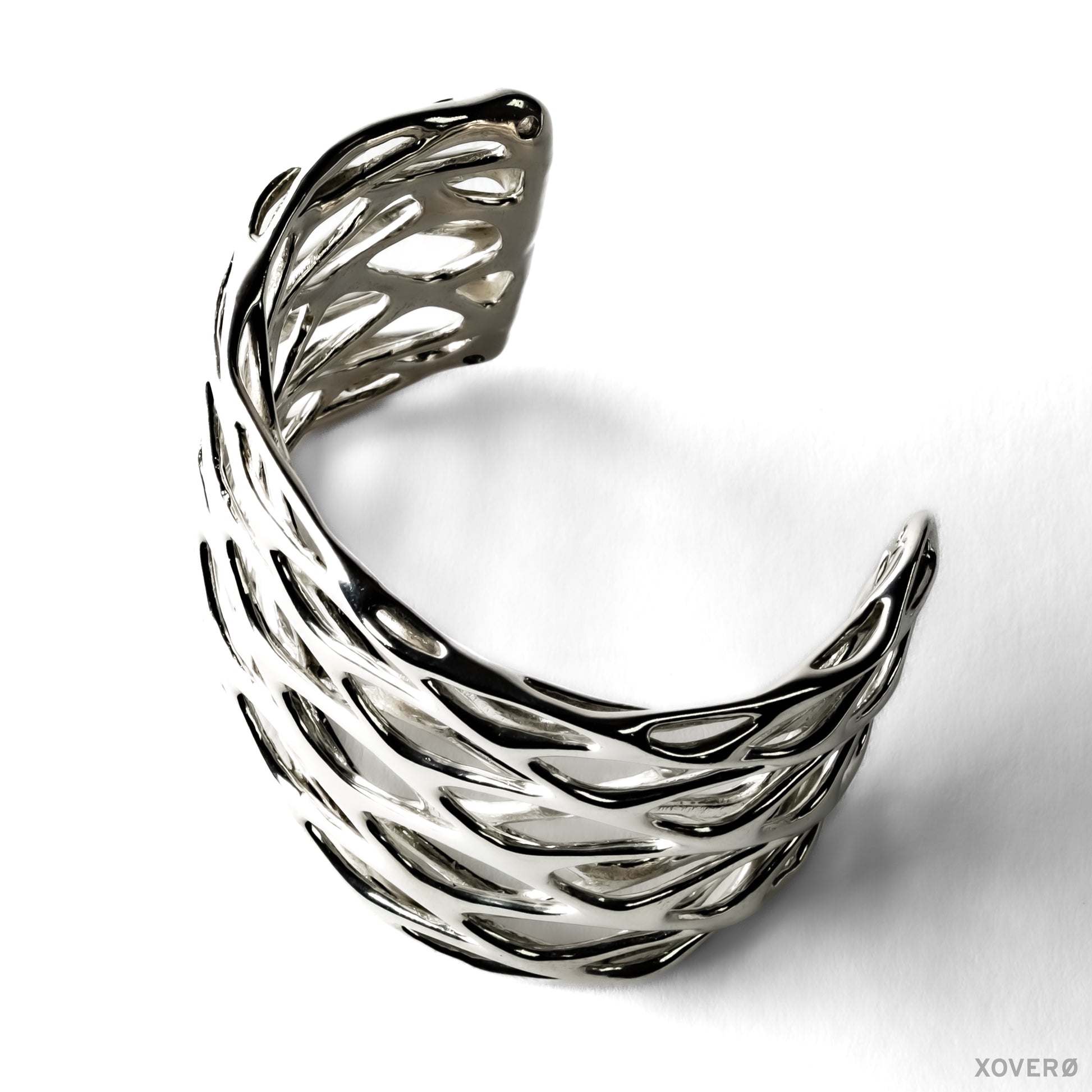 Thick chunky latticework cuff bracelet crafted from solid sterling silver. The smooth fluid lattice is sculpted into a wrist shaped arc. 