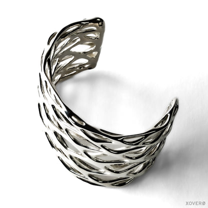 Thick chunky latticework cuff bracelet crafted from solid sterling silver. The smooth fluid lattice is sculpted into a wrist shaped arc. 