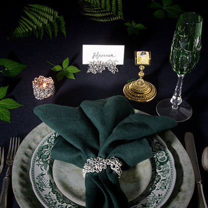 A formal dining table set for Afroman including the gold weed gummy chalice which holds a lemon pound cake flavored edible. 