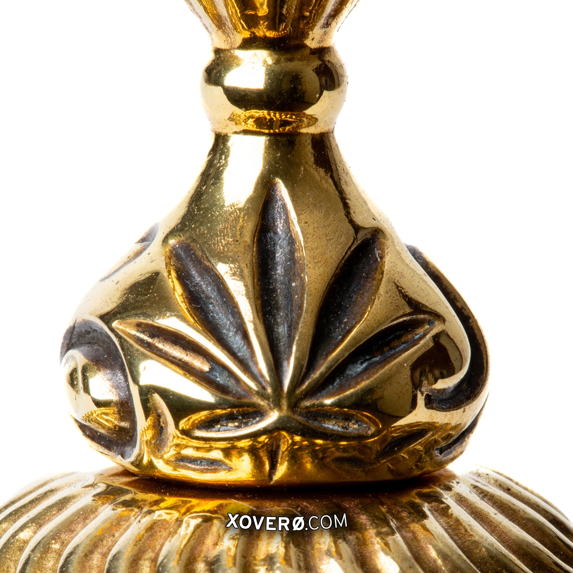 Close up of an oxidized marijuana leaf detail on Xover0s novel gummy chalice for enjoying cannabis at the formal dining table. 