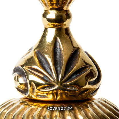 Close up of an oxidized marijuana leaf detail on Xover0s novel gummy chalice for enjoying cannabis at the formal dining table. 